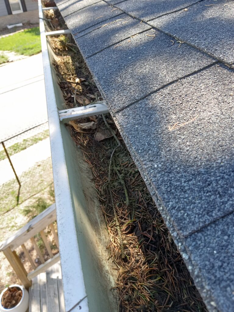 gutter build up that needs cleaning